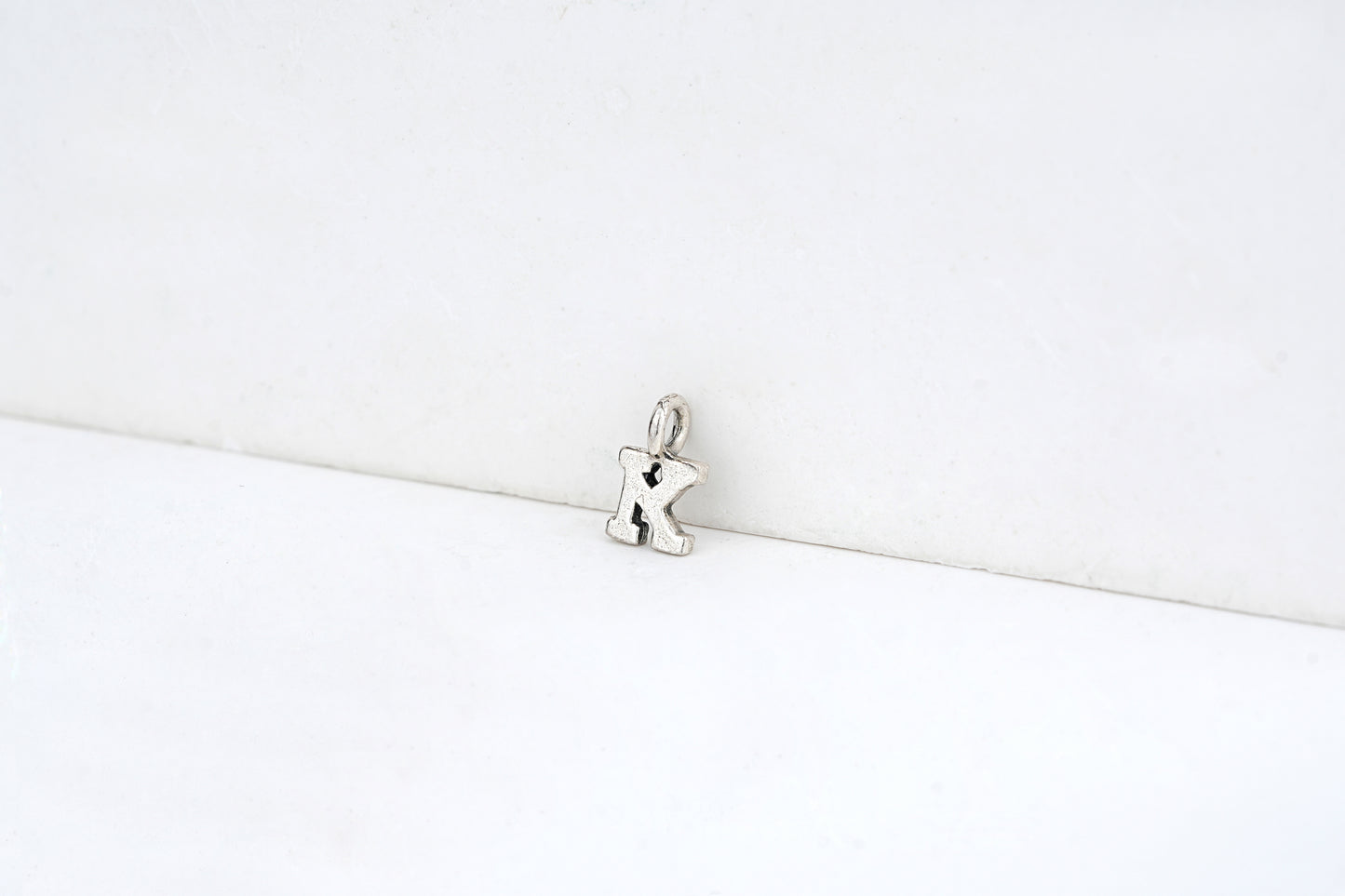 k - detail shot - English letter charm | Love Letters Tel Aviv