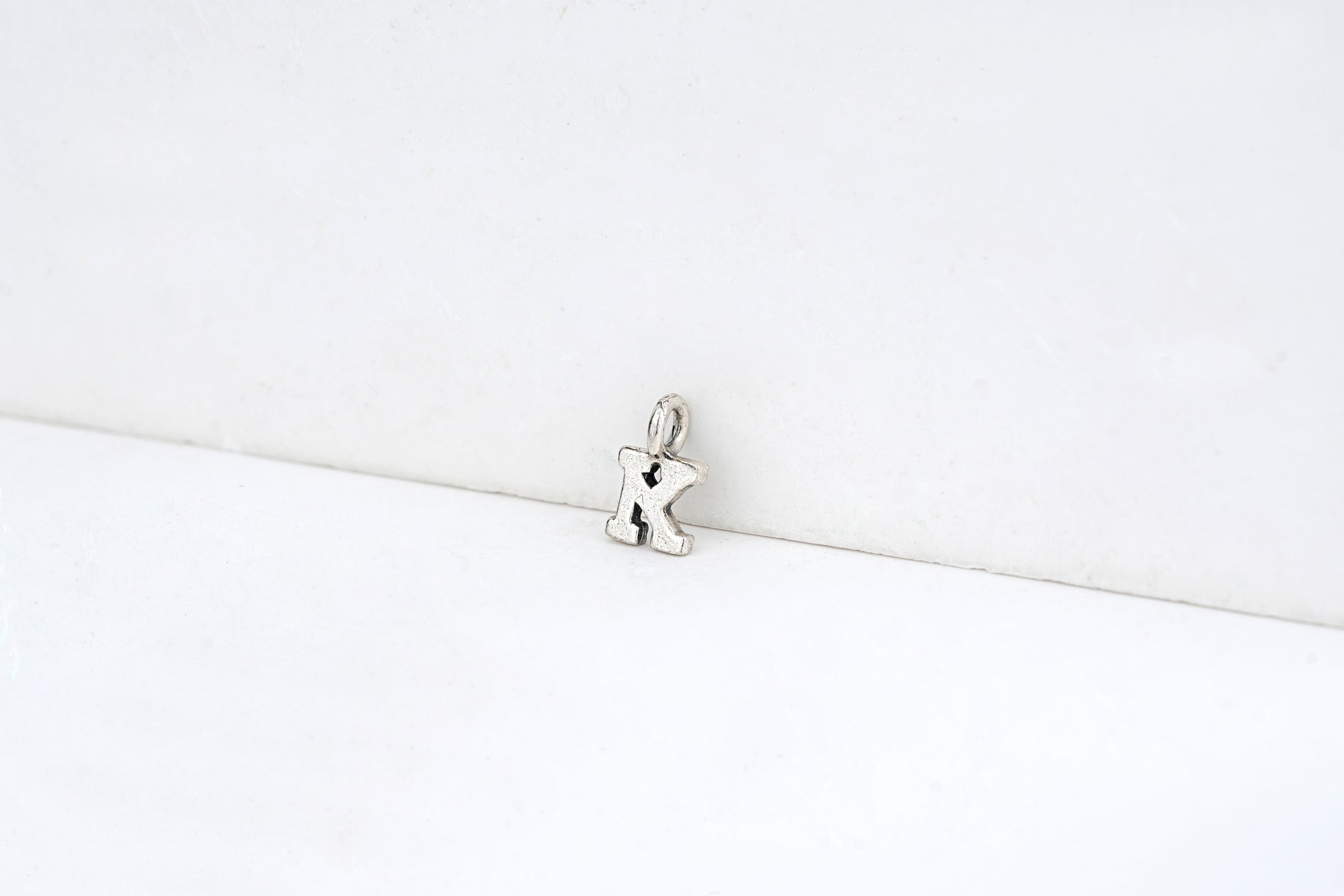 k - detail shot - English letter charm | Love Letters Tel Aviv