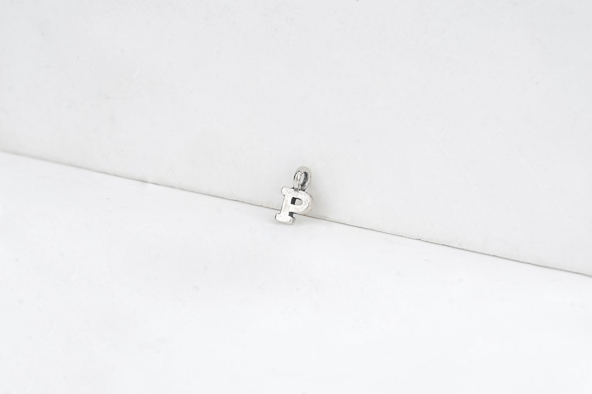 p - detail shot - English letter charm | Love Letters Tel Aviv