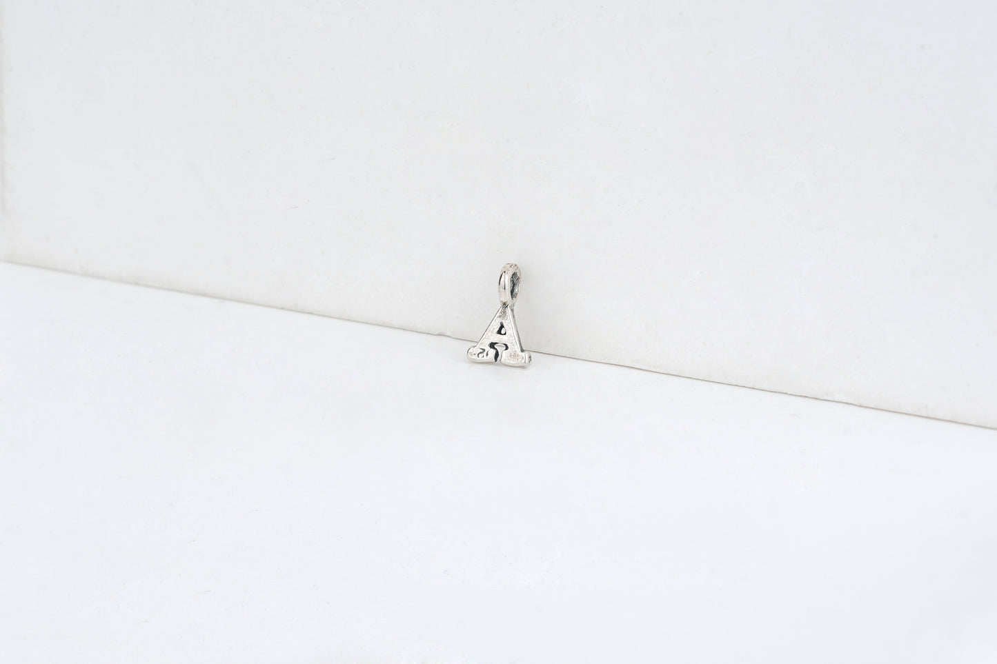 a - detail shot - English letter charm | Love Letters Tel Aviv