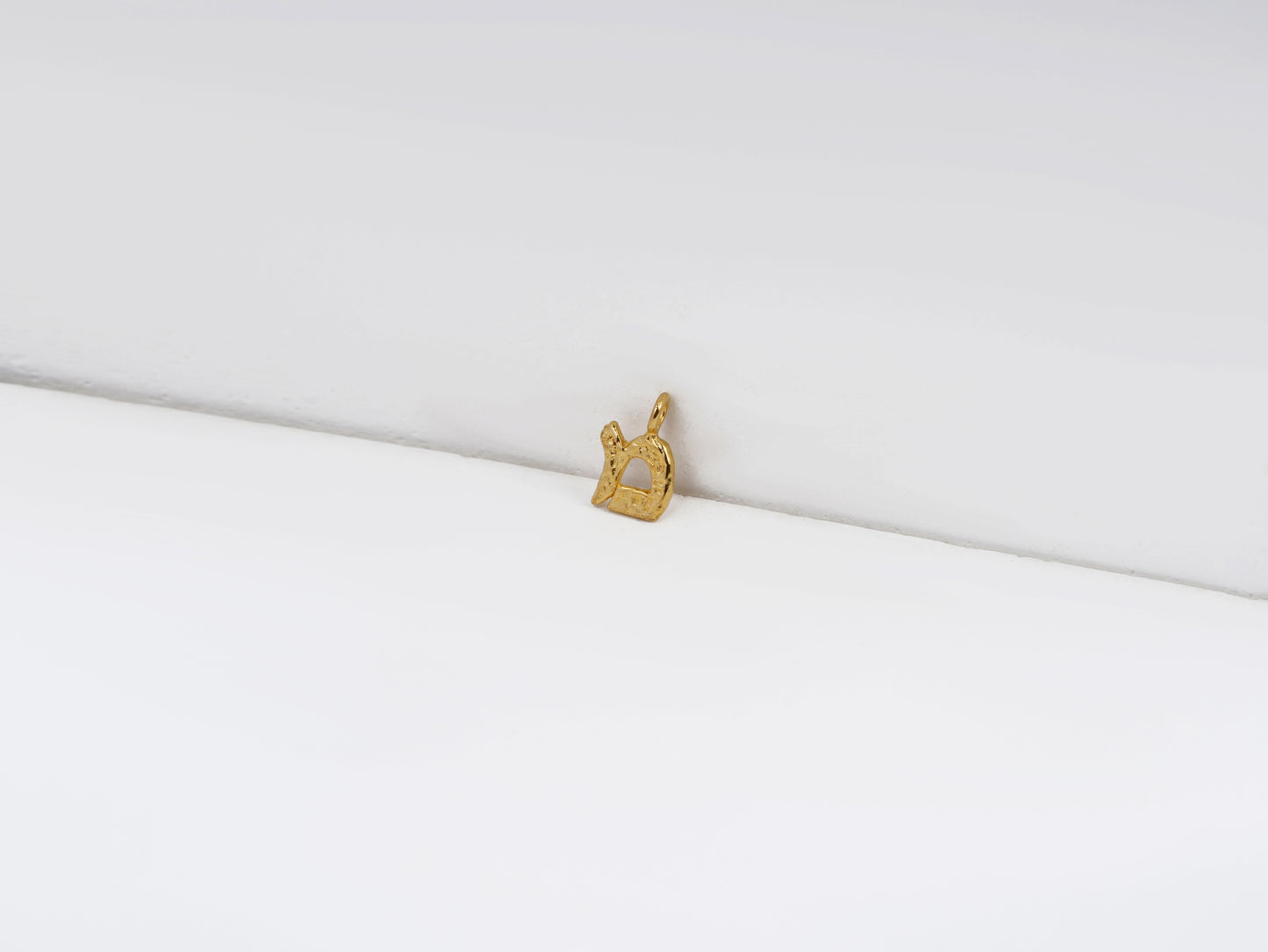 מ - mem - detail shot - Hebrew letter charm | Love Letters Tel Aviv
