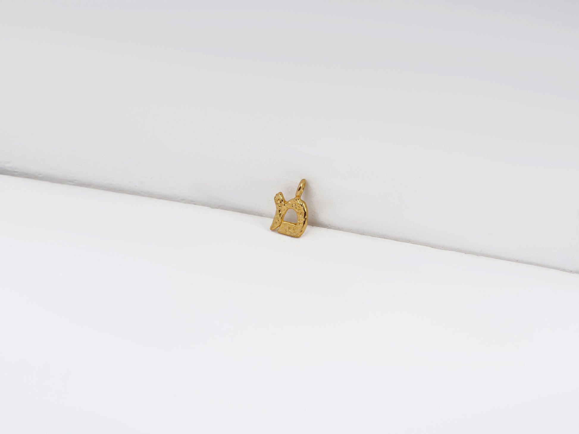 מ - mem - detail shot - Hebrew letter charm | Love Letters Tel Aviv