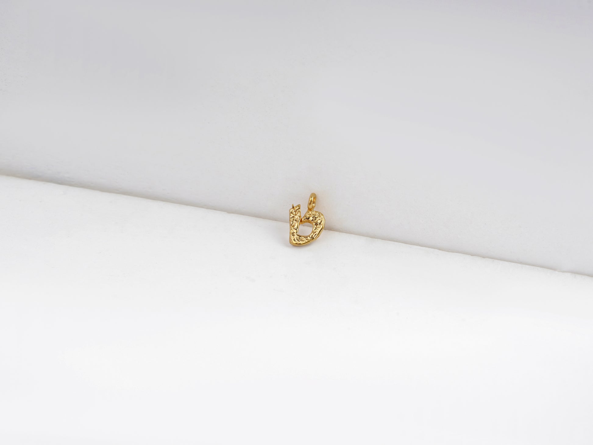 ט - tet - detail shot - Hebrew letter charm | Love Letters Tel Aviv