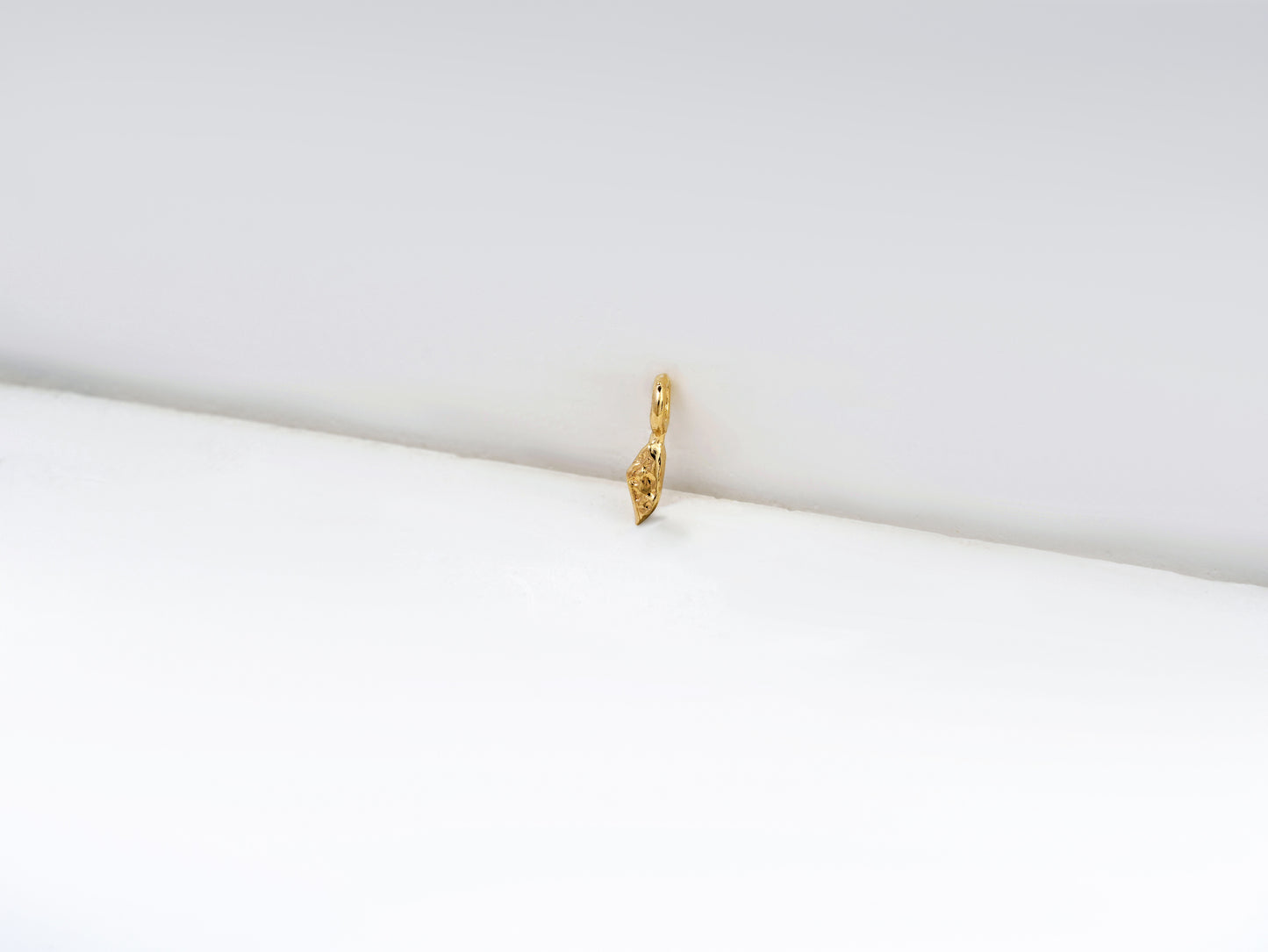 י - yud - detail shot - Hebrew letter charm | Love Letters Tel Aviv