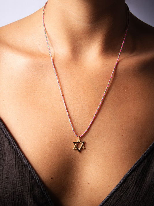 medium golden magen david on pink string - worn on model - necklace | Love Letters Tel Aviv