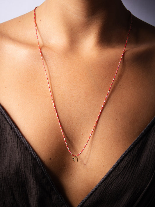 Cutie golden chai  on red string - worn on model - necklace | Love Letters Tel Aviv